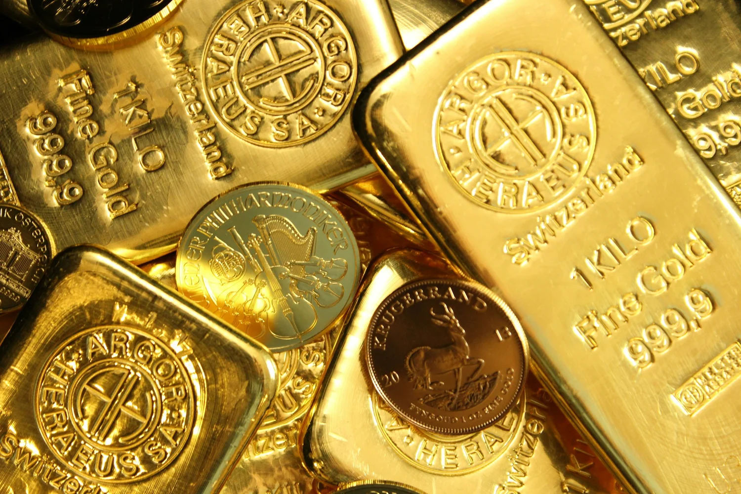 Gold bars and coins representing investment capital